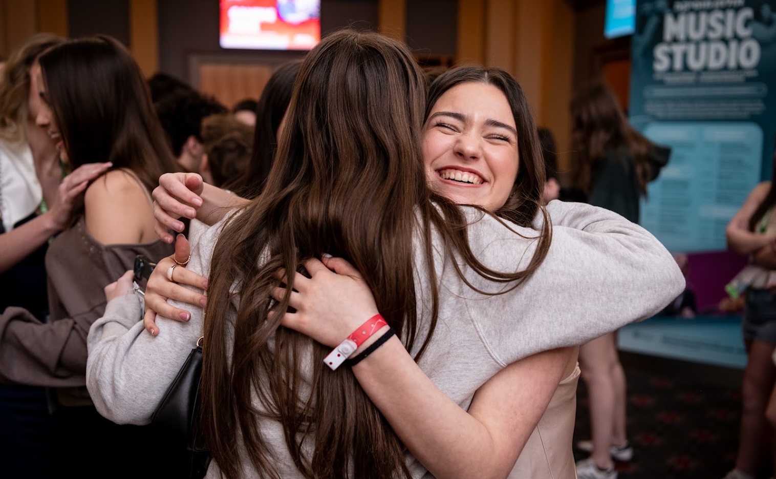 Group of diverse young people smiling at a community event