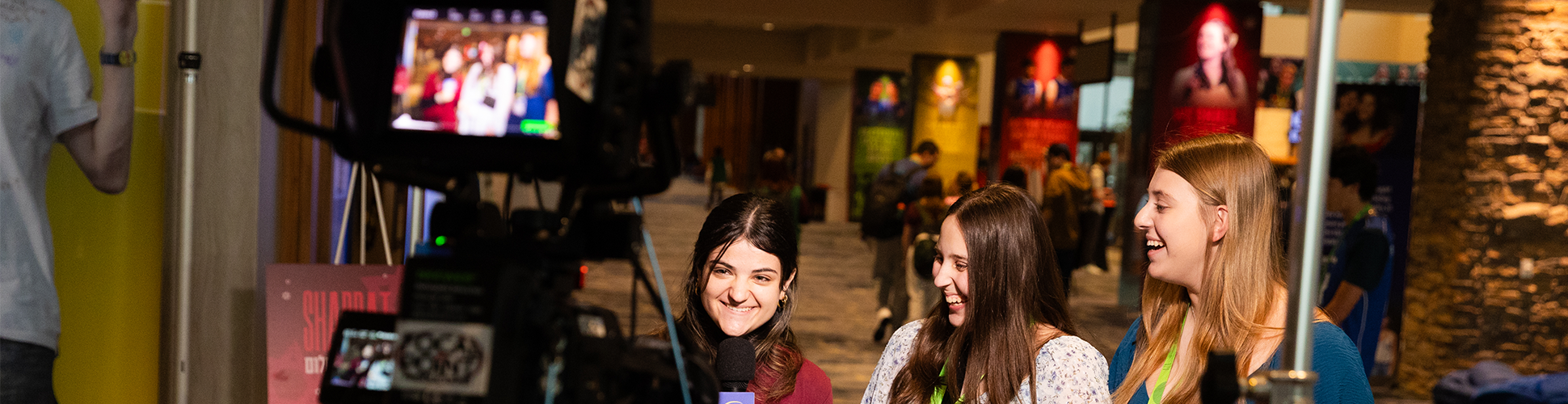 Group of diverse young people smiling at a community event