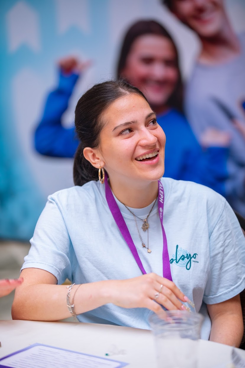 Group of diverse young people smiling at a community event