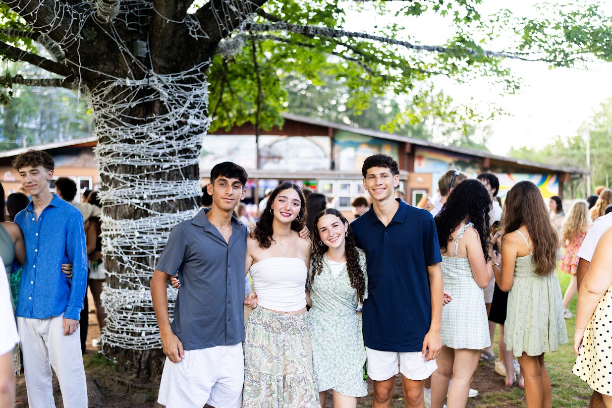 Three friends sitting on a hammock