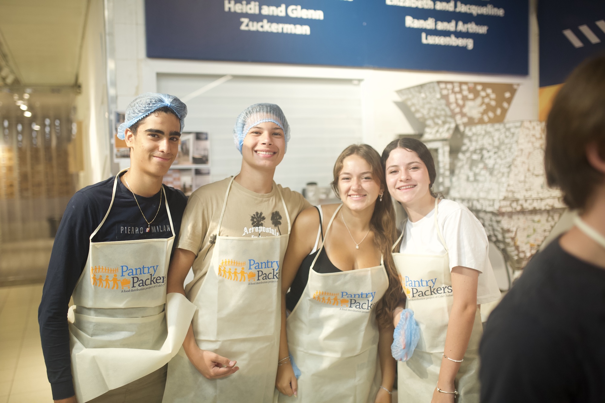 Group of diverse young people smiling at a community event