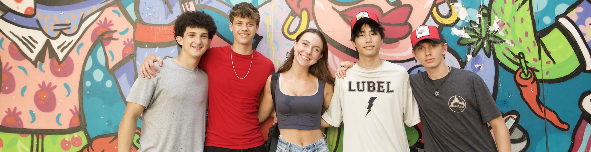 Group of diverse young people smiling at a community event