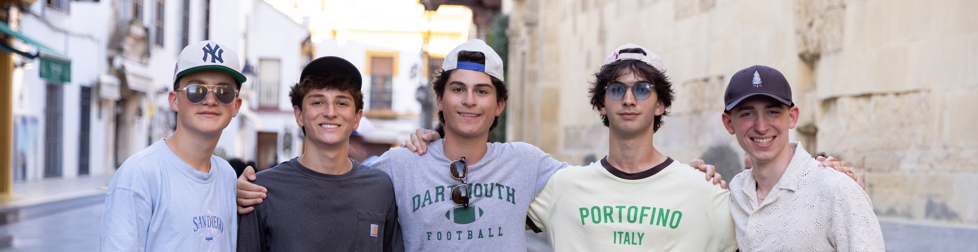 Group of diverse young people smiling at a community event