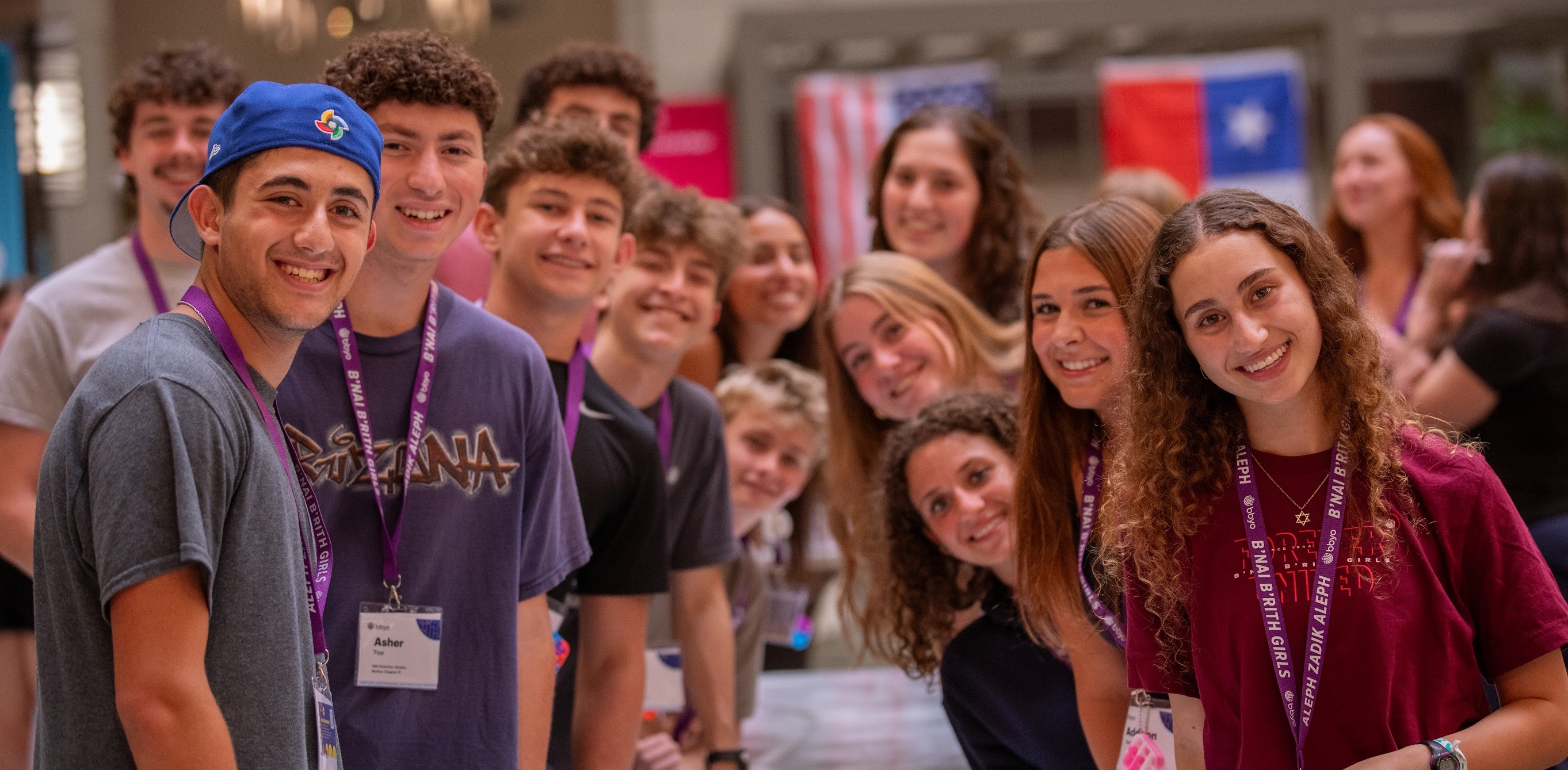 Group of diverse young people smiling at a community event