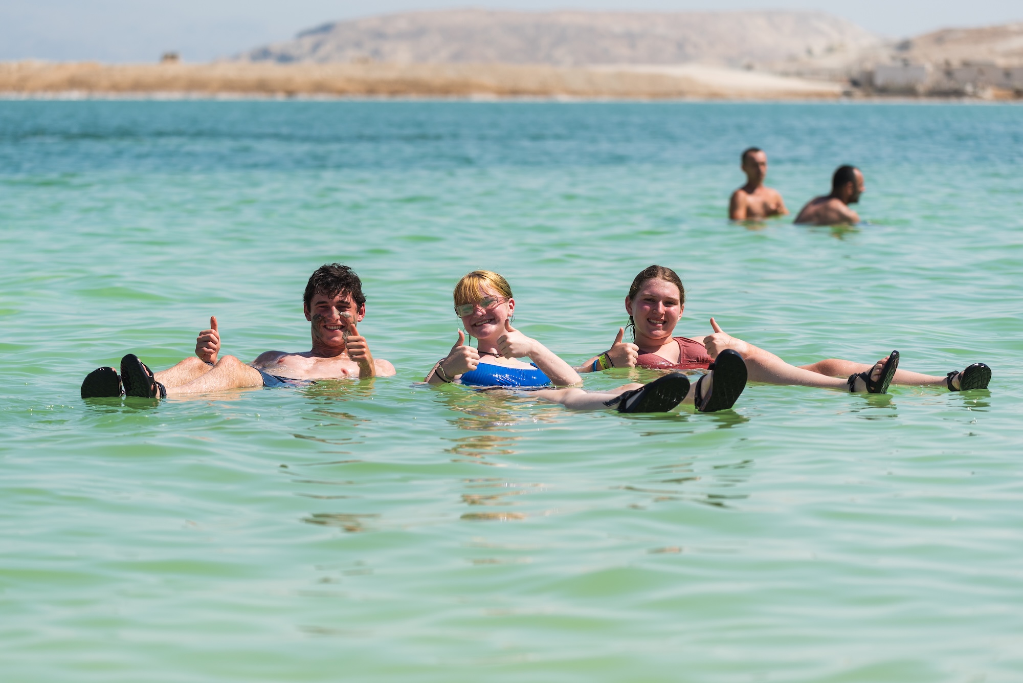 Group of people smiling outdoors