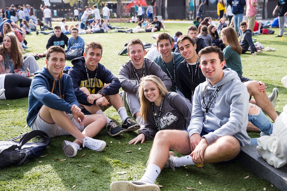 Group of diverse young people smiling at a community event