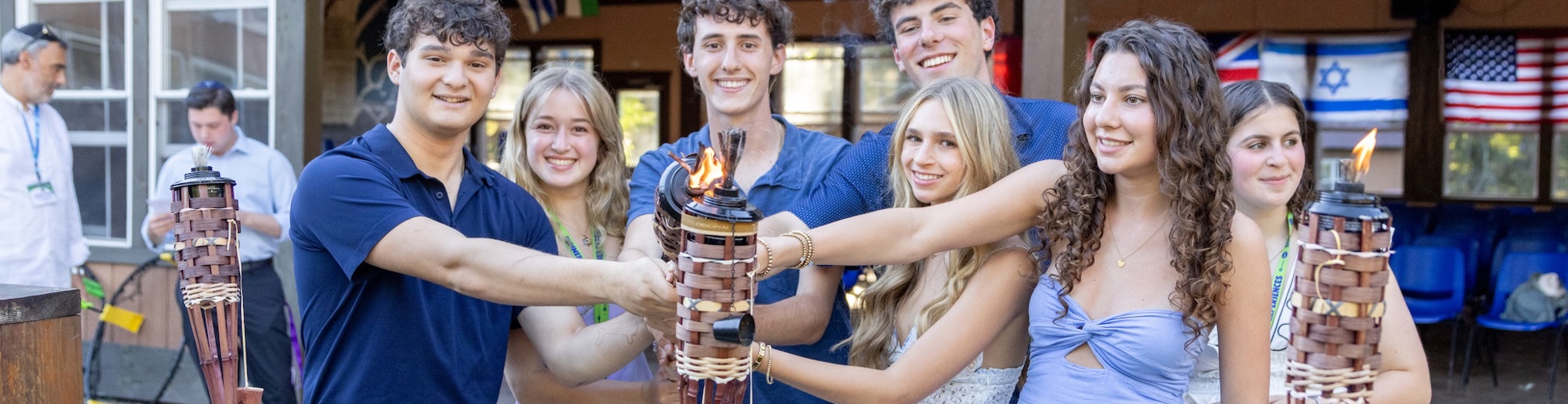 Group of diverse young people smiling at a community event