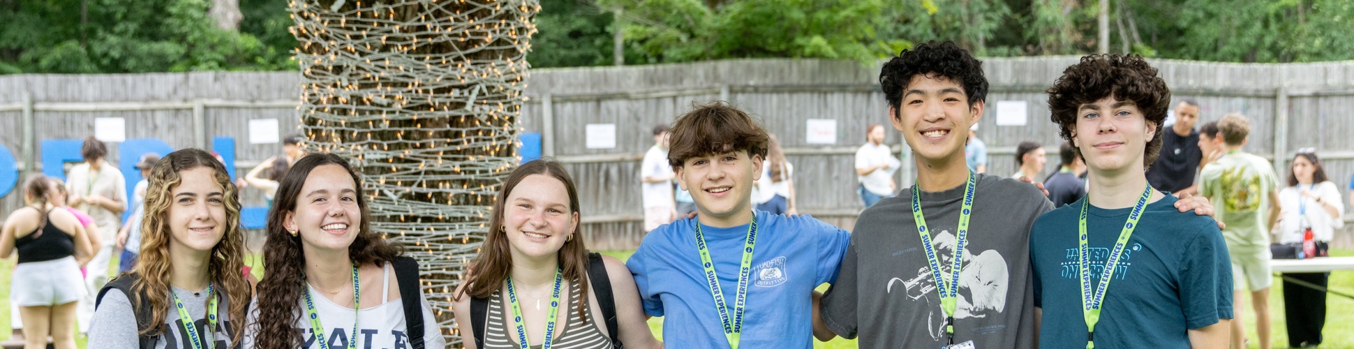 Group of diverse young people smiling at a community event