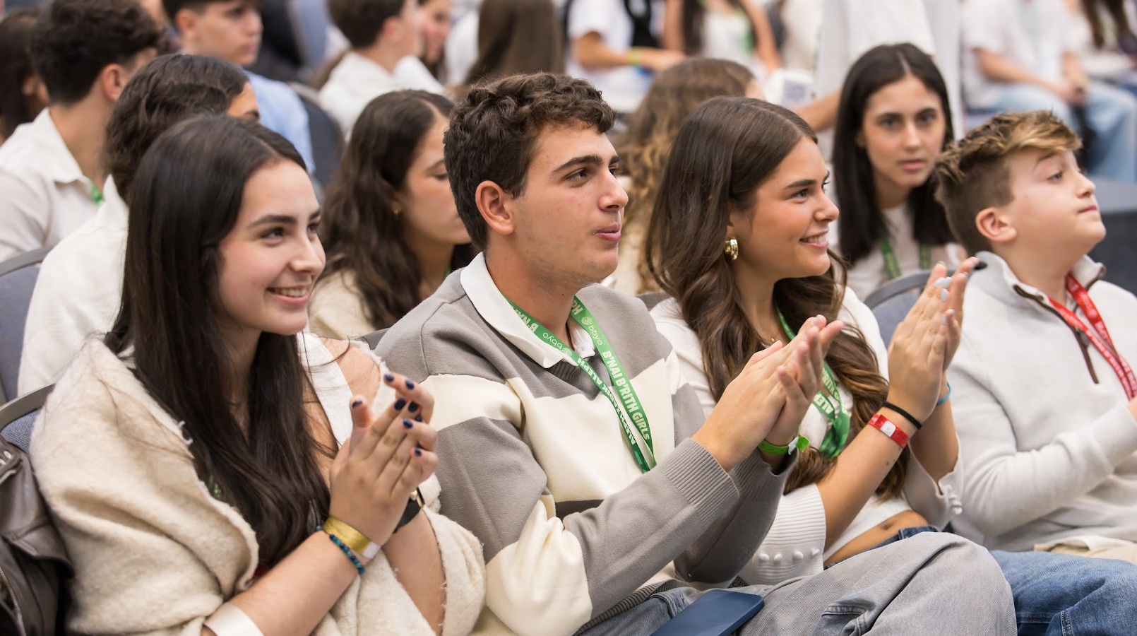 Group of diverse young people smiling at a community event