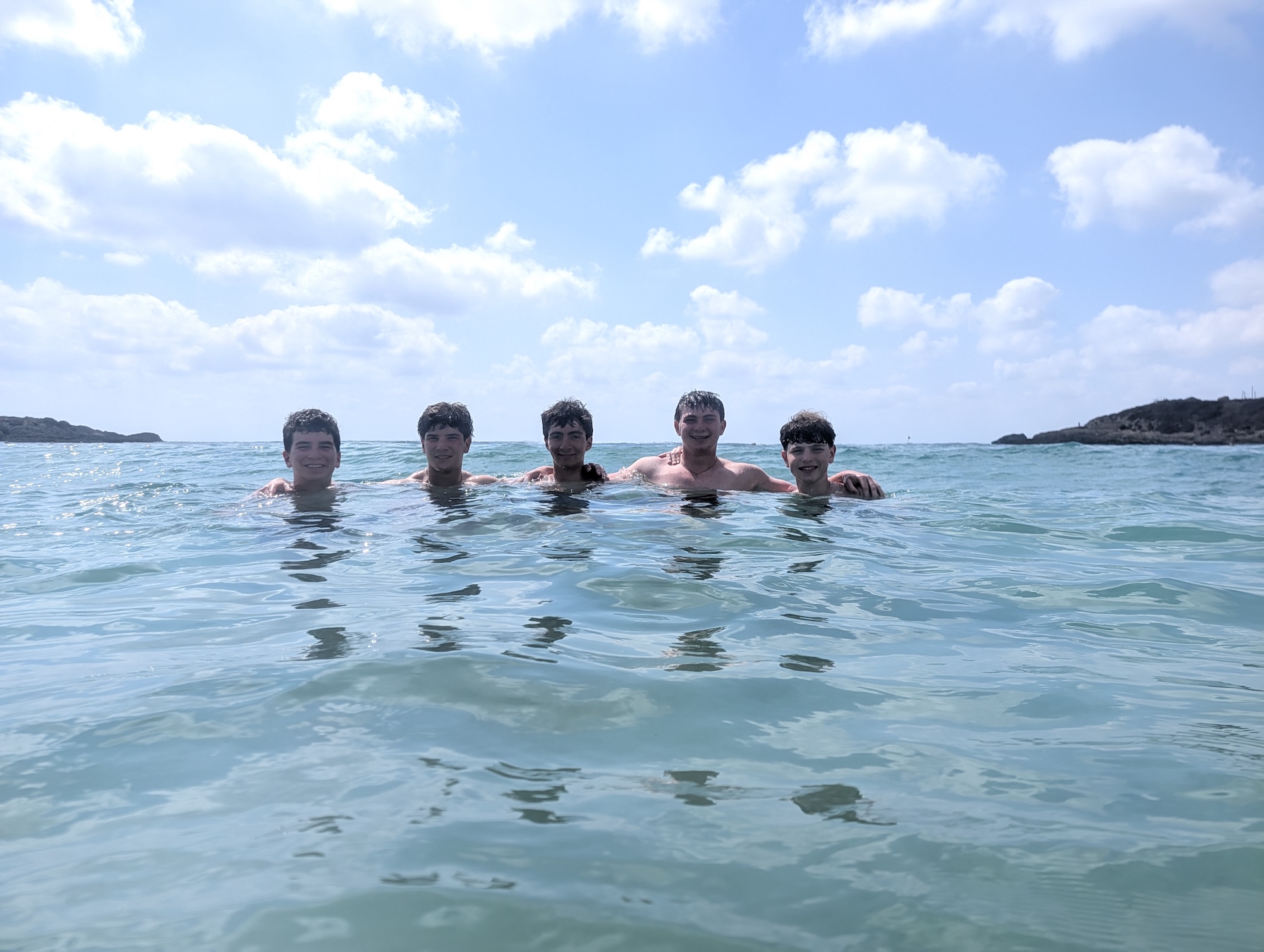 Group of people smiling outdoors