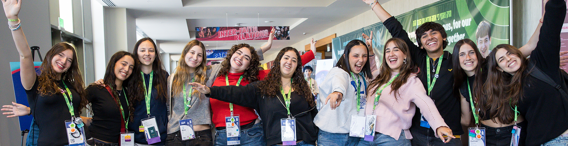 Group of diverse young people smiling at a community event