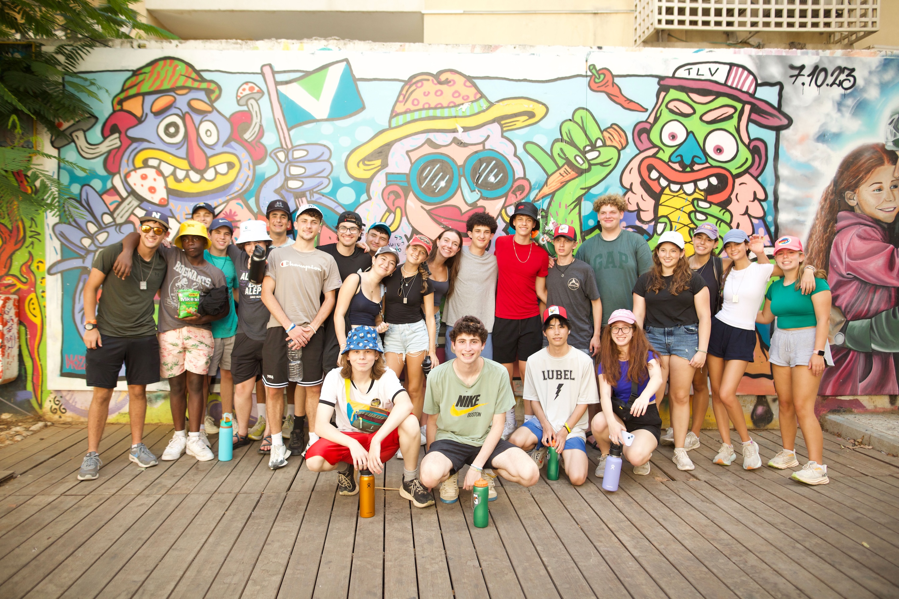 Group of diverse young people smiling at a community event