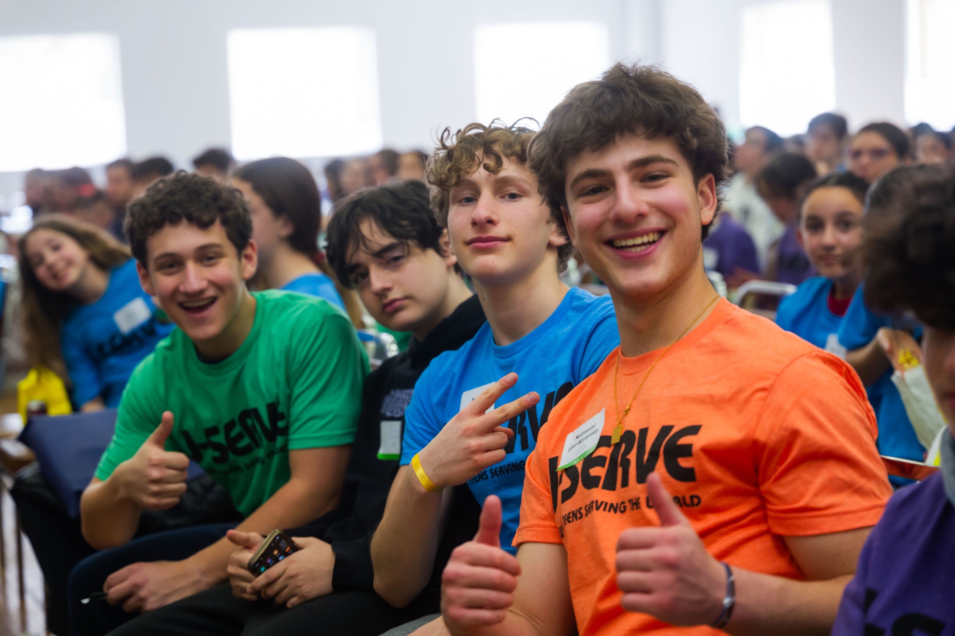 Group of diverse young people smiling at a community event