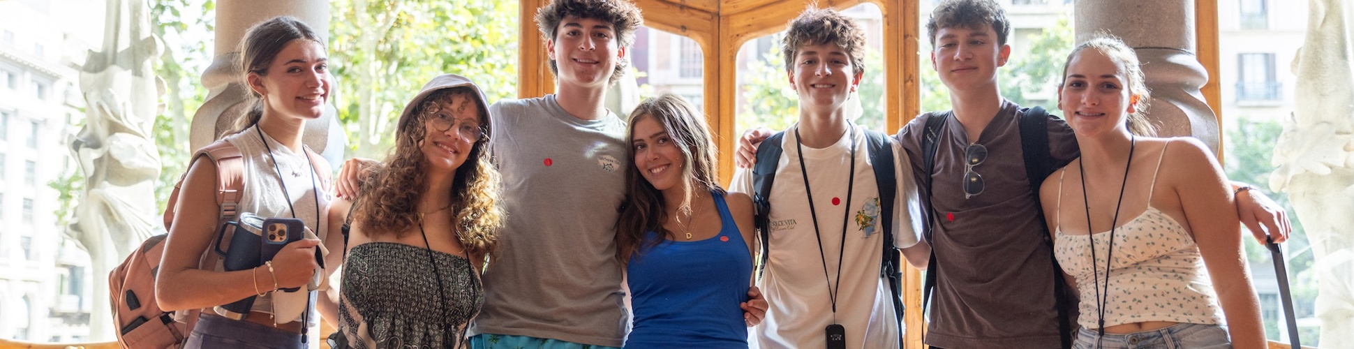 Group of diverse young people smiling at a community event