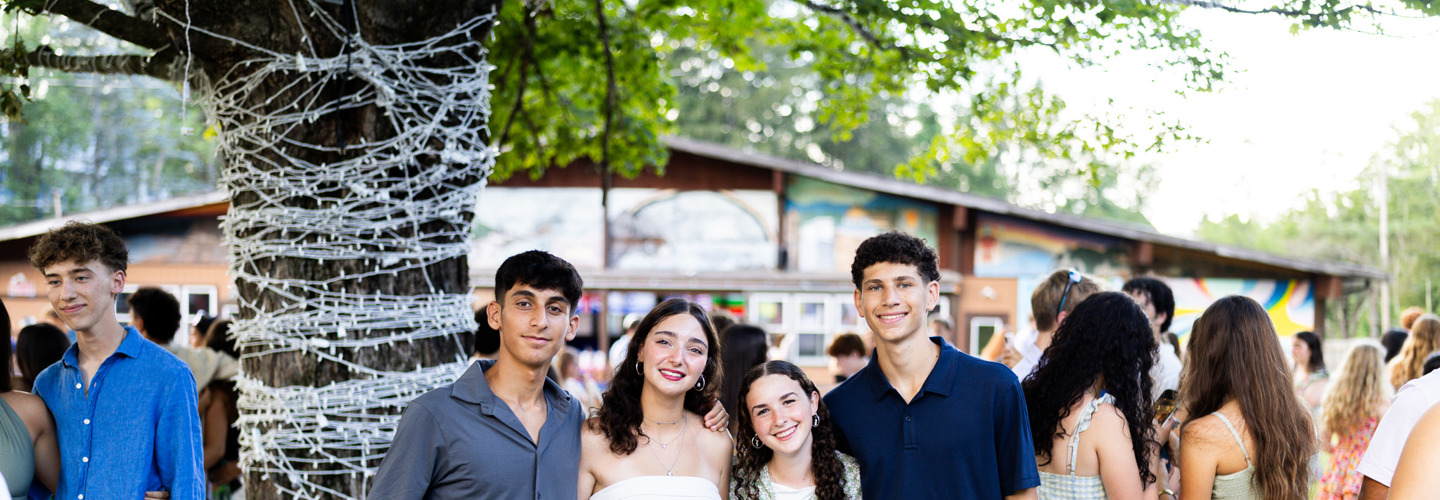 Group of diverse young people smiling at a community event