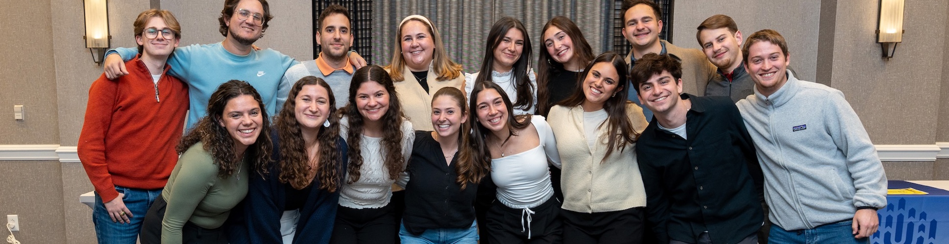 Group of diverse young people smiling at a community event
