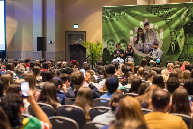 Group of people celebrating on stage