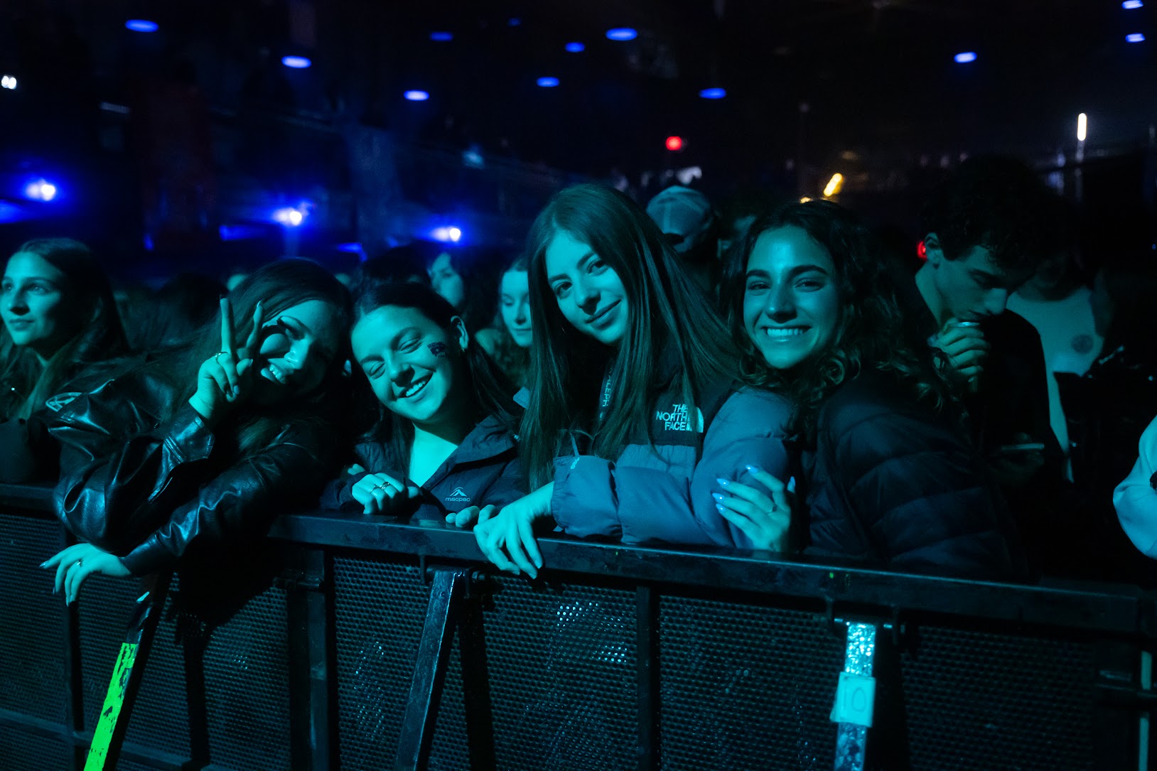 Group of diverse young people smiling at a community event