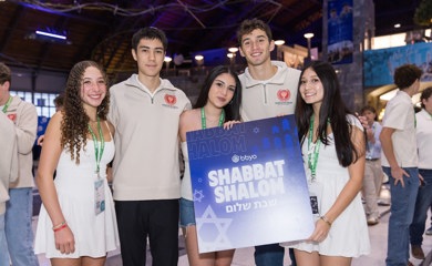 Group of three smiling parents at a community event