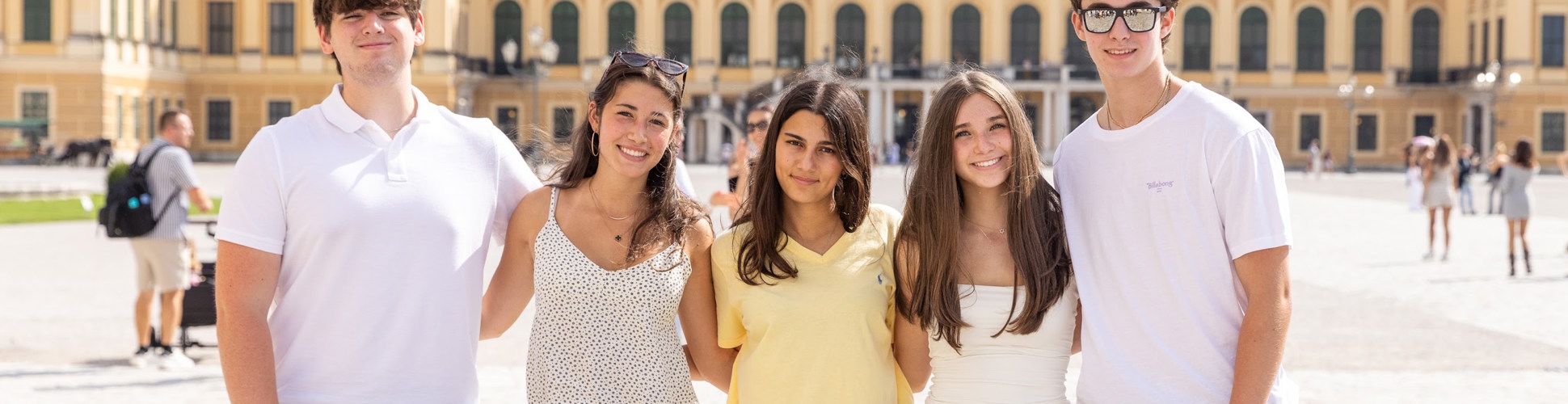 Group of diverse young people smiling at a community event
