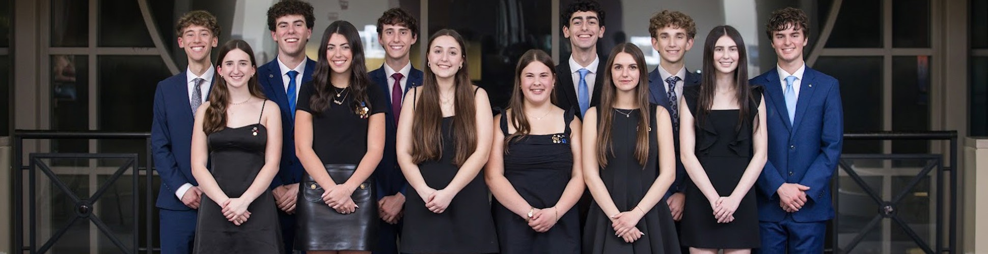 Group of diverse young people smiling at a community event