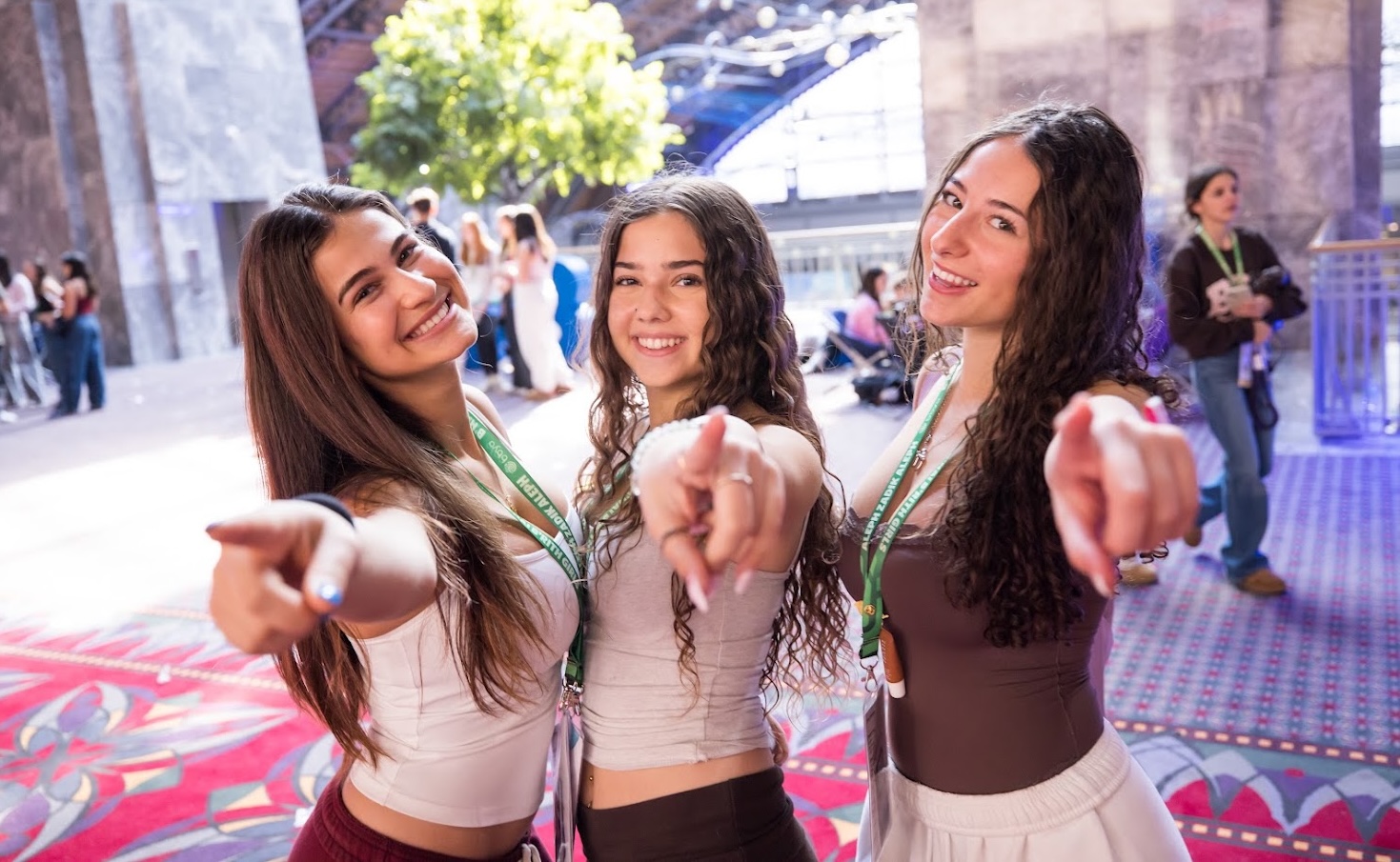 Group of diverse young people smiling at a community event