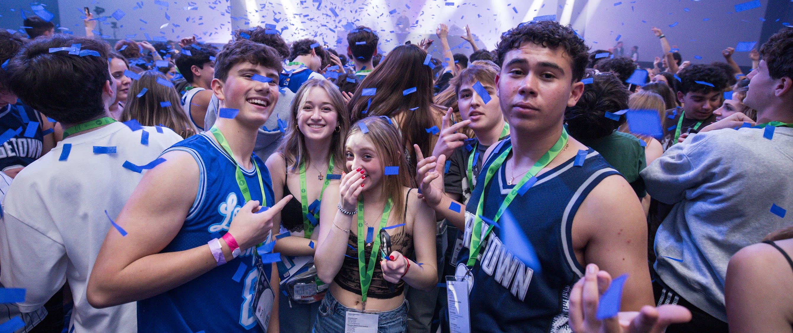 Group of diverse young people smiling at a community event