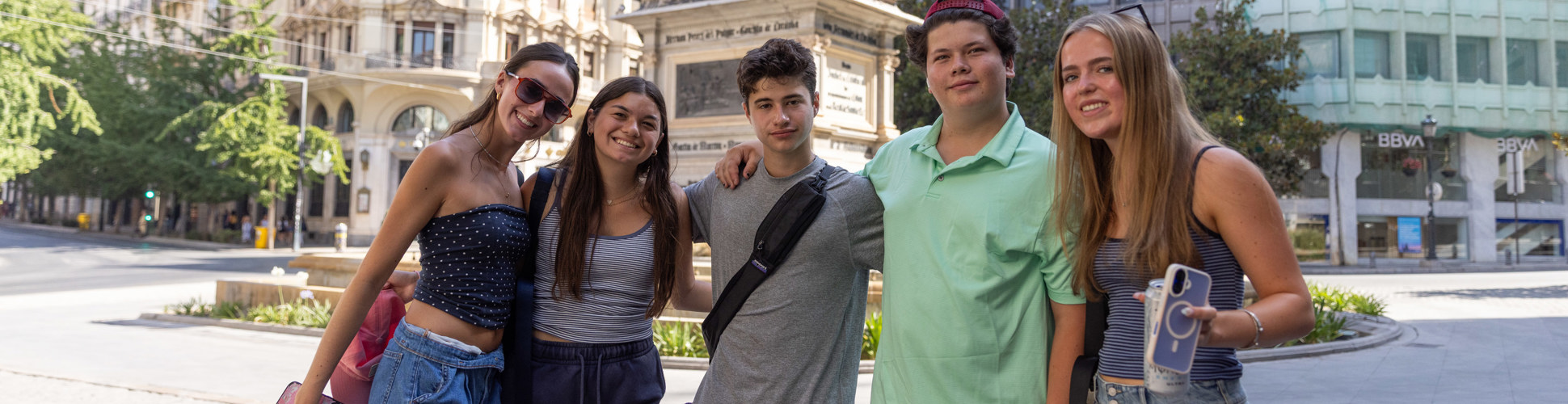 Group of diverse young people smiling at a community event