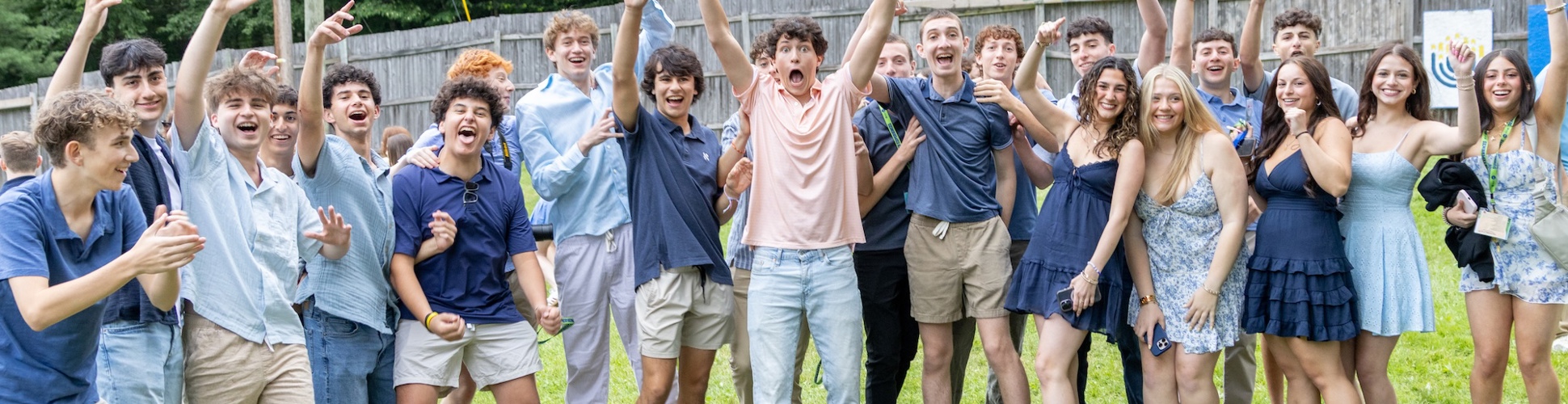 Group of diverse young people smiling at a community event
