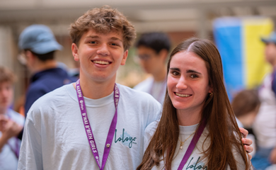 Group of three smiling parents at a community event