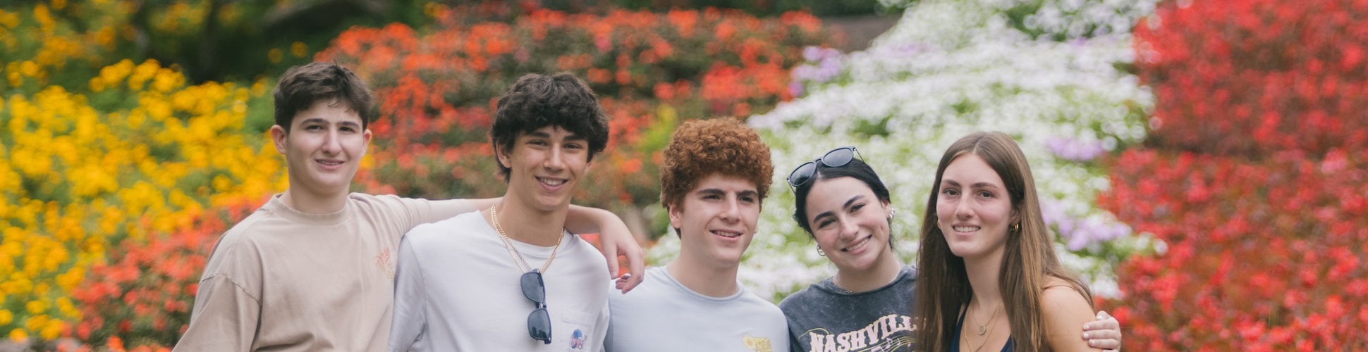 Group of diverse young people smiling at a community event