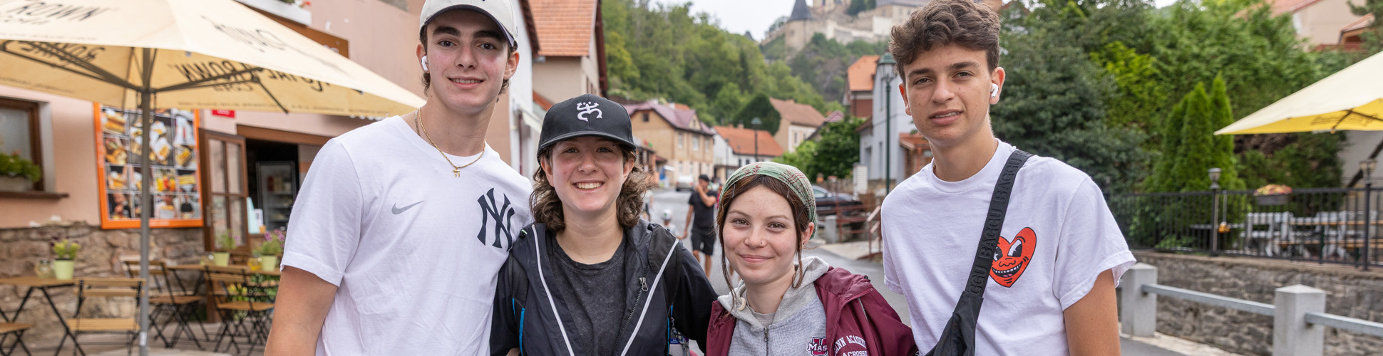 Group of diverse young people smiling at a community event