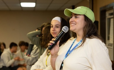 Group of three smiling parents at a community event