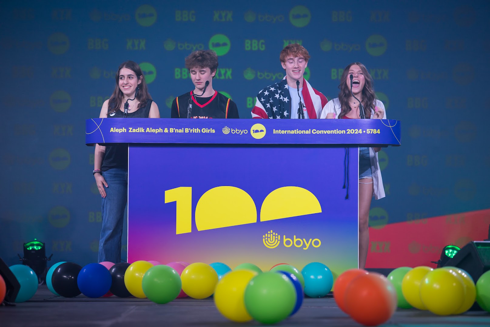 Group of diverse young people smiling at a community event