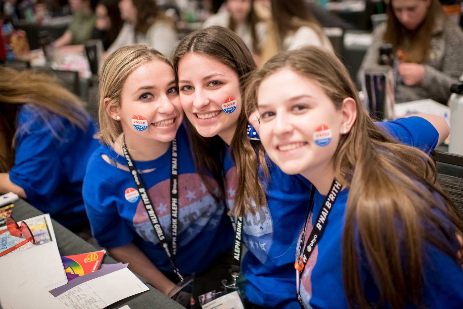Group of diverse young people smiling at a community event