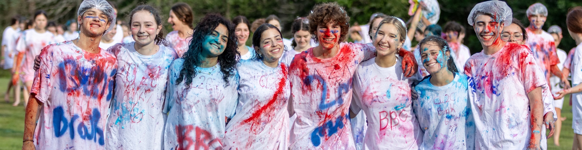 Group of diverse young people smiling at a community event