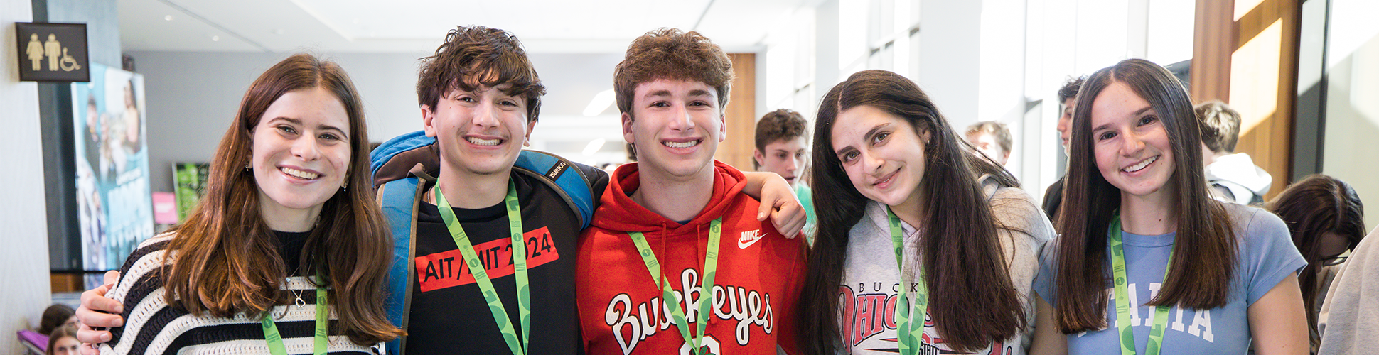 Group of diverse young people smiling at a community event