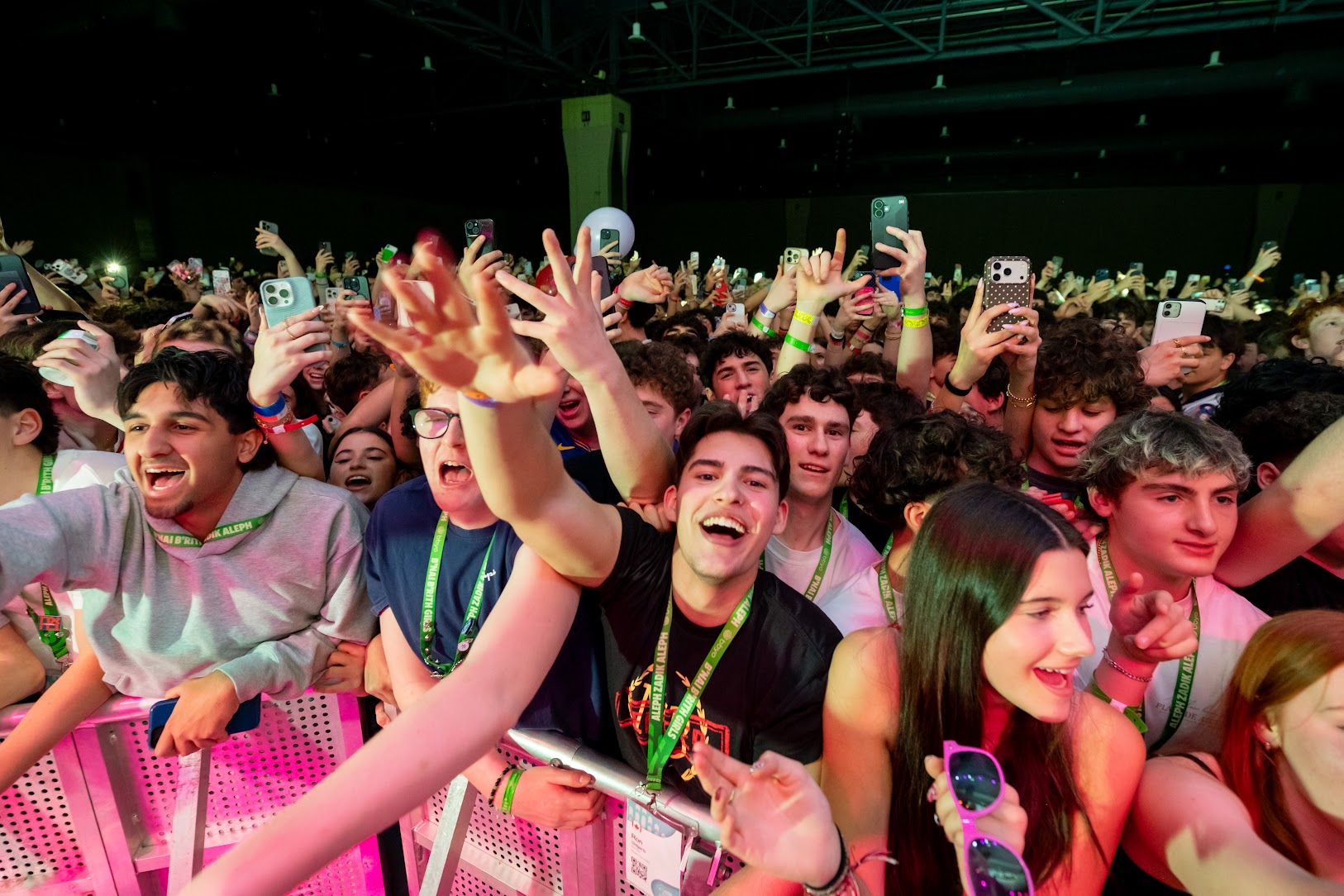 Group of diverse young people smiling at a community event