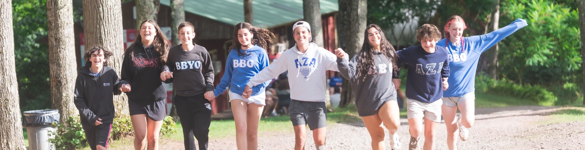Group of diverse young people smiling at a community event