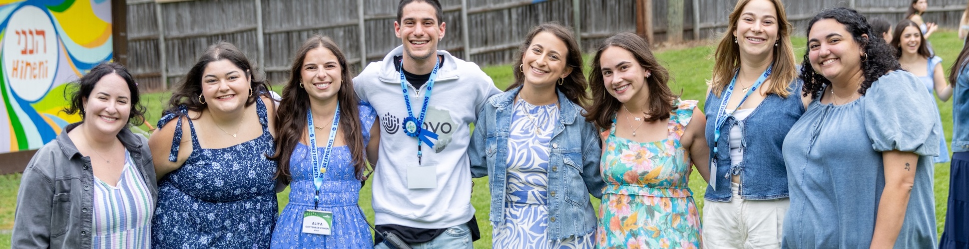 Group of diverse young people smiling at a community event