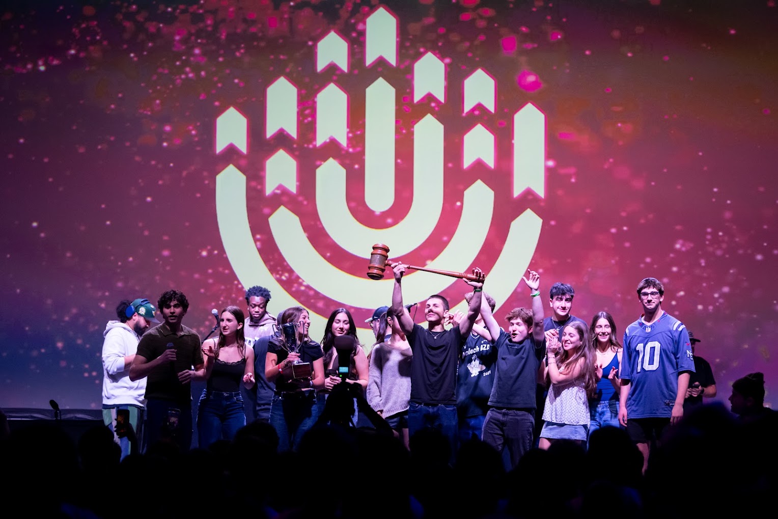 Group of diverse young people smiling at a community event