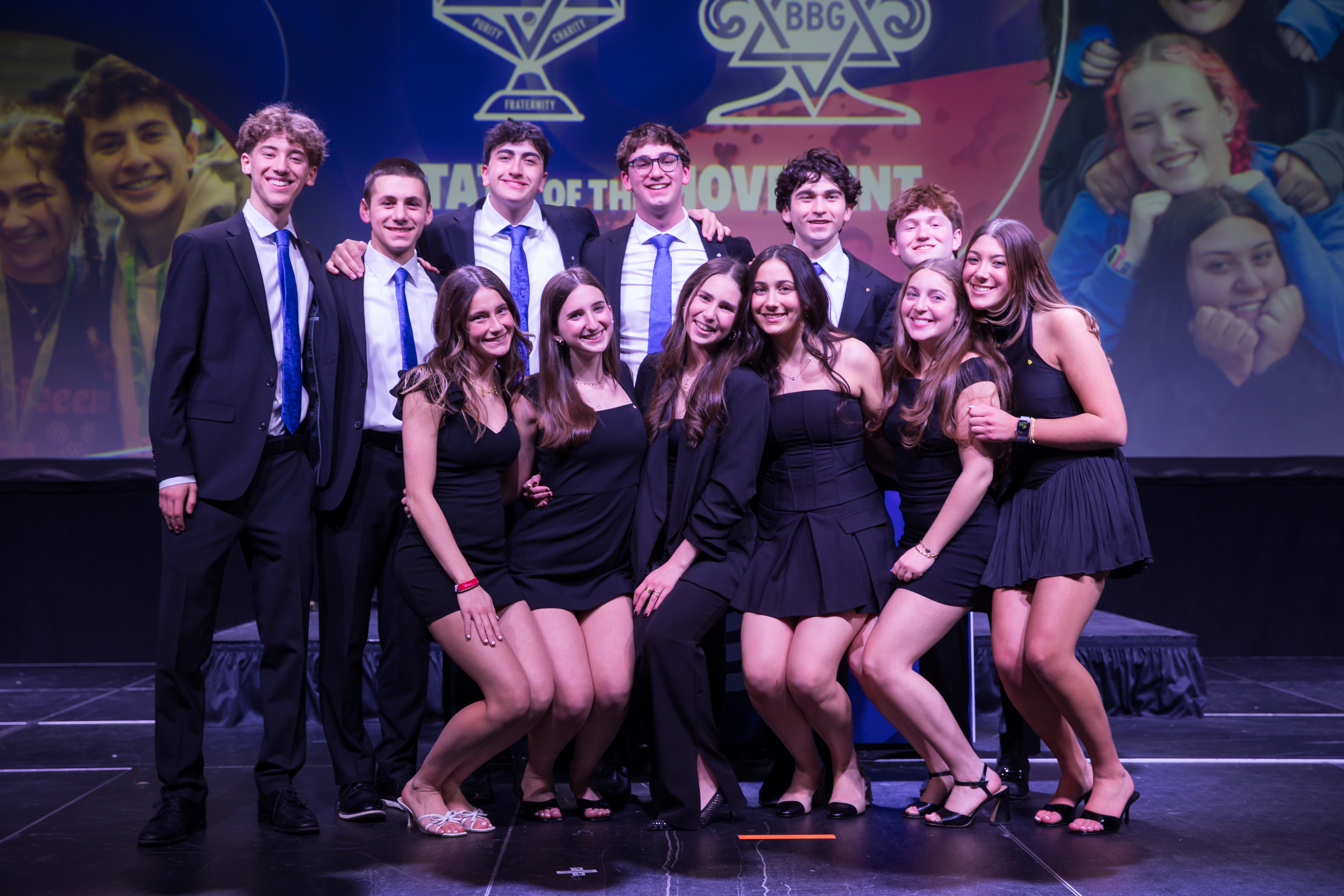 Group of people celebrating on stage