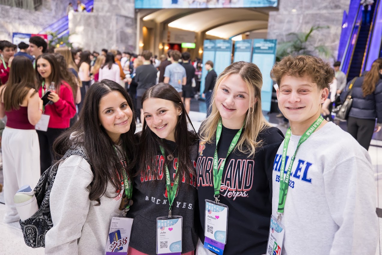 Group of diverse young people smiling at a community event